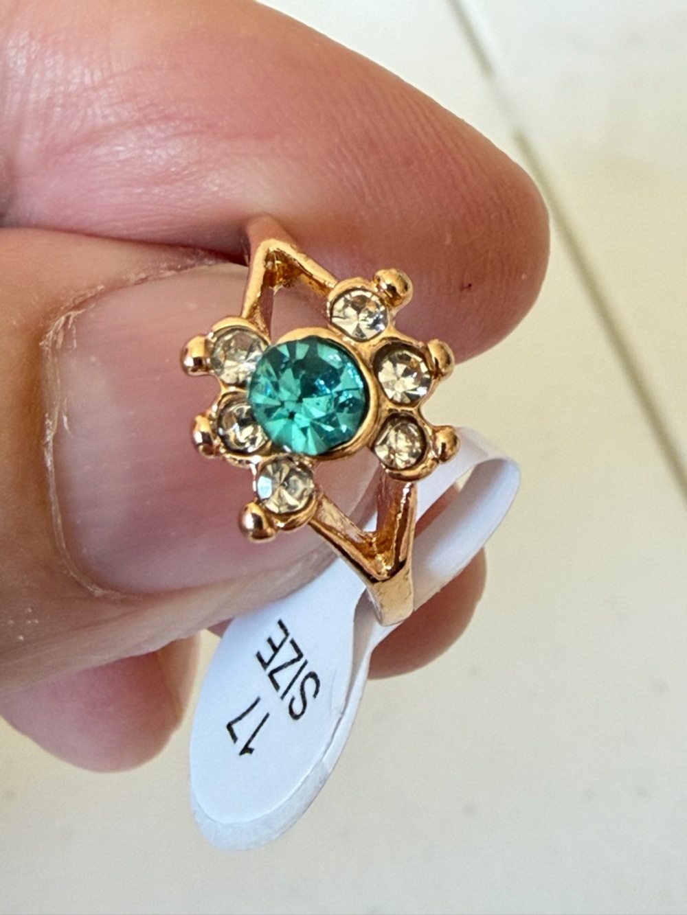 Gold Ring with Teal and Clear Accents.